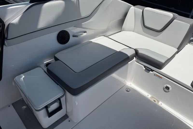 Slide: The Image of 2025 Yamaha Boats AR250 interior seating with sleek, modern design and integrated storage. - 26
