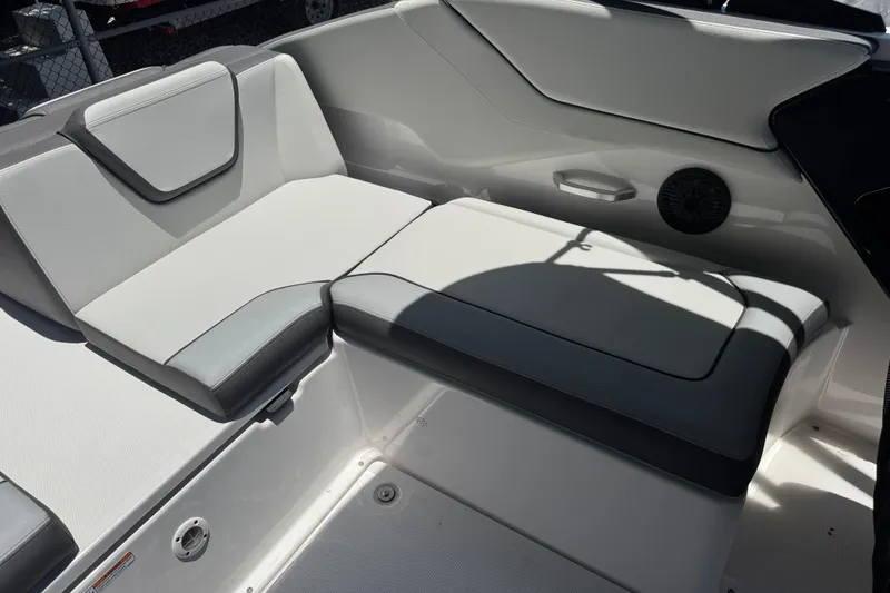 Slide: The Image of 2025 Yamaha Boats AR250 interior seating with modern design and comfortable upholstery. - 27