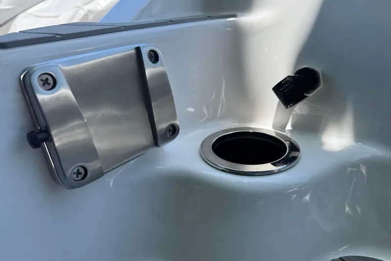 Slide: The Image of 2025 Yamaha Boats AR250 interior detail with stainless steel cup holder and fixture. - 32