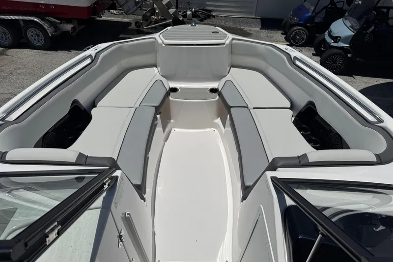 Slide: The Image of 2025 Yamaha Boats AR250 interior with spacious seating and modern design. - 4