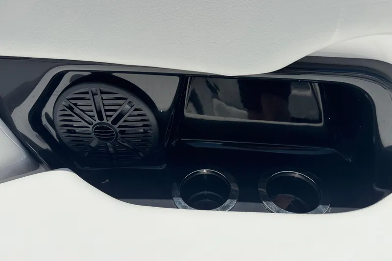 Slide: The Image of 2025 Yamaha AR250 boat interior with speaker and cup holders. - 9