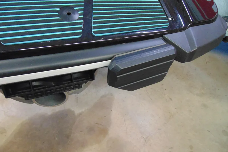 Slide: The Image of 2024 Yamaha WaveRunner EX Sport rear platform with teal accents and black bumper. - 7