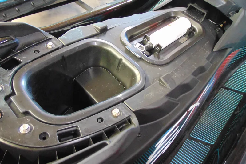 Slide: The Image of 2024 Yamaha WaveRunner EX Sport storage compartment and fire extinguisher holder. - 8