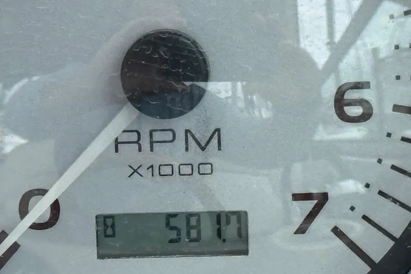 Slide: The Image of Close-up of a 2004 Rinker 342 tachometer showing 5817 RPM. - 4