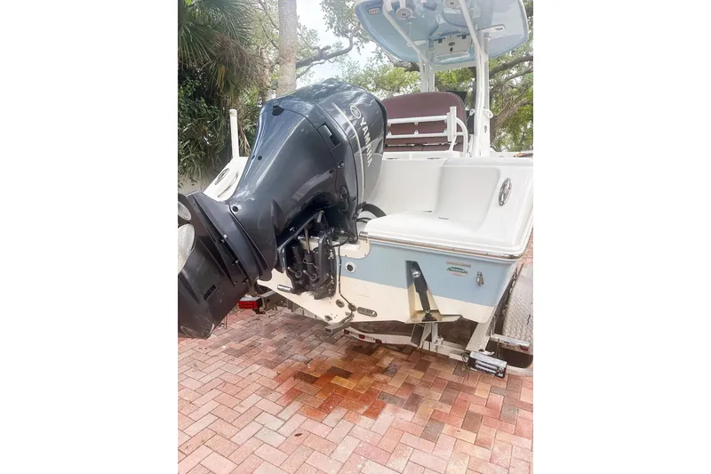 Slide: The Image of 2017 Tidewater 230 CC Adventure boat with Yamaha outboard motor on brick driveway. - 6