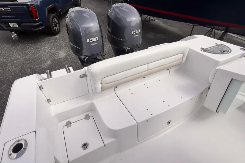 Slide: The Image of 2014 Sportsman Heritage 251 Center Console with twin Yamaha 150 engines, rear seating view. - 6