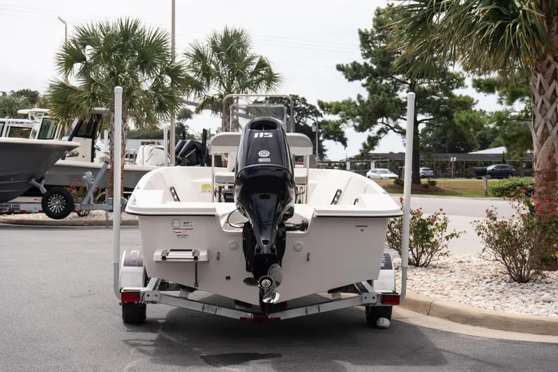 Slide: The Image of 2026 Carolina Skiff EV180 Sea Skiff on trailer, parked near palm trees. - 5