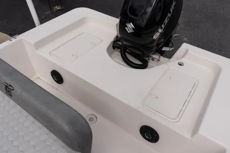 Slide: The Image of 2026 Carolina Skiff EV180 Sea Skiff with Suzuki outboard motor, rear deck view. - 7