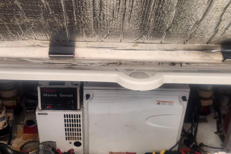 Slide: The Image of Engine compartment of 2002 Cruisers Yachts 3870 Express with Onan Marine Genset. - 19