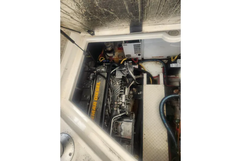 Slide: The Image of Engine compartment of a 2002 Cruisers Yachts 3870 Express, featuring a Yanmar diesel engine. - 18