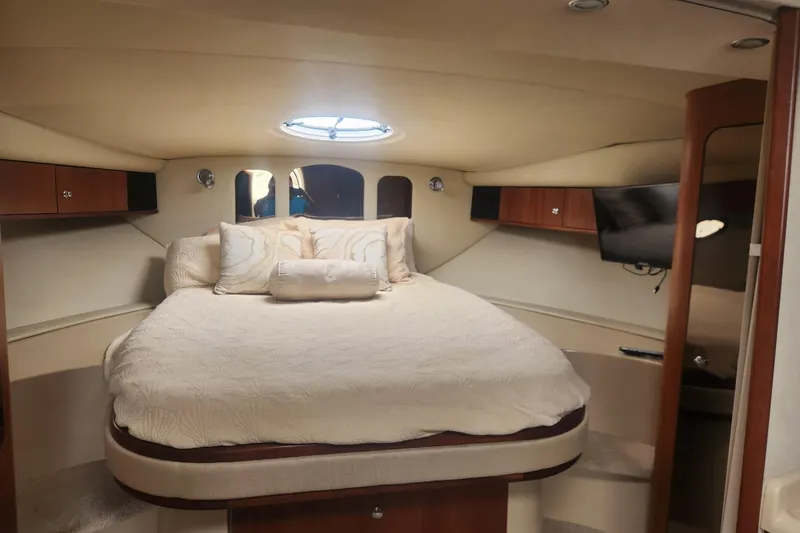 Slide: The Image of Luxurious cabin interior of 2002 Cruisers Yachts 3870 Express with cozy bedding. - 9