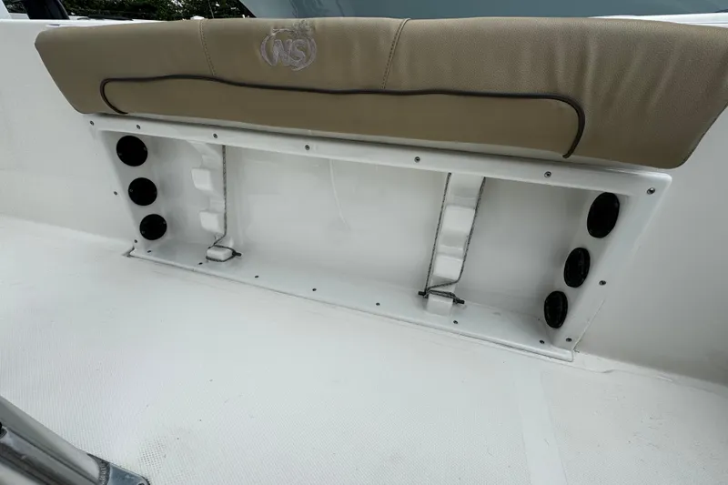 Slide: The Image of 2019 NauticStar 22 XS Offshore boat seating and storage compartment. - 13