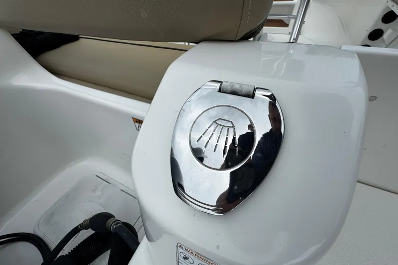 Slide: The Image of 2019 NauticStar 22 XS Offshore boat shower control detail. - 19