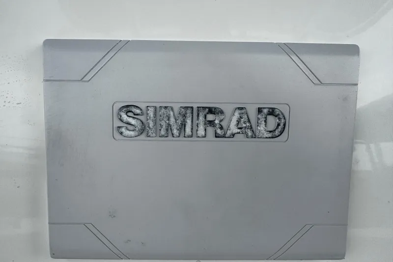 Slide: The Image of Simrad device on 2019 NauticStar 22 XS Offshore boat dashboard. - 24