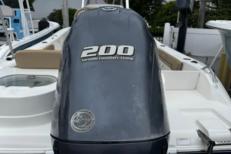 Slide: The Image of 2019 NauticStar 22 XS Offshore boat with 200 horsepower engine, featuring variable camshaft timing. - 29