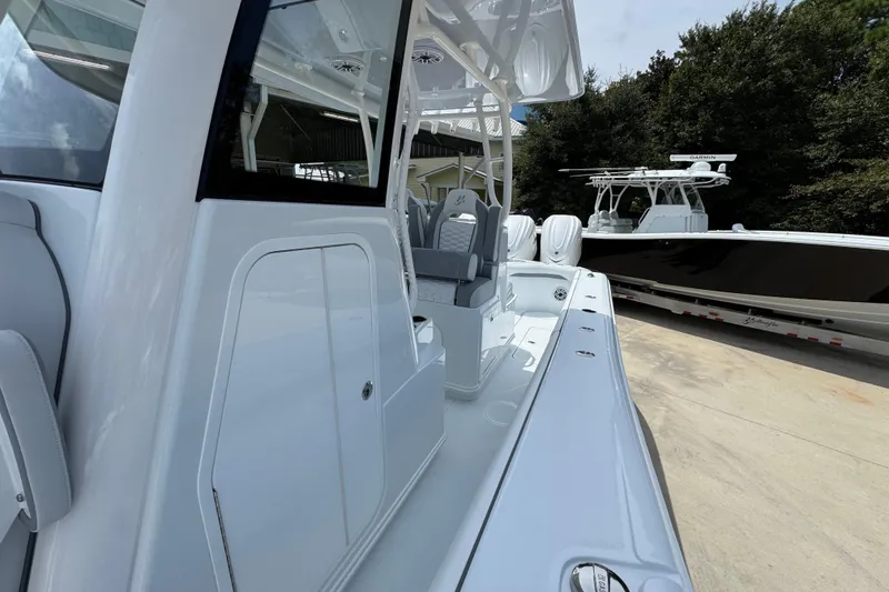 Slide: The Image of 2026 Yellowfin 36 Offshore boat, sleek design, parked outdoors, showcasing modern features. - 25