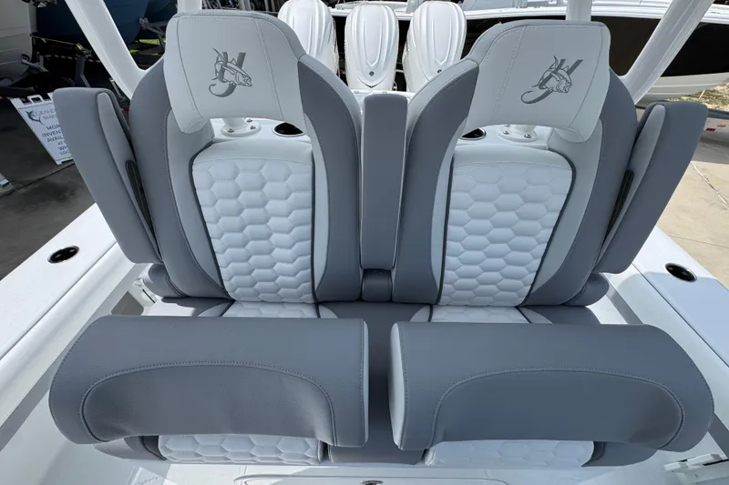 Slide: The Image of 2026 Yellowfin 36 Offshore boat seats with gray and white hexagonal pattern upholstery. - 29