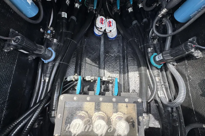 Slide: The Image of Engine compartment of 2026 Yellowfin 36 Offshore boat with visible wiring and components. - 42