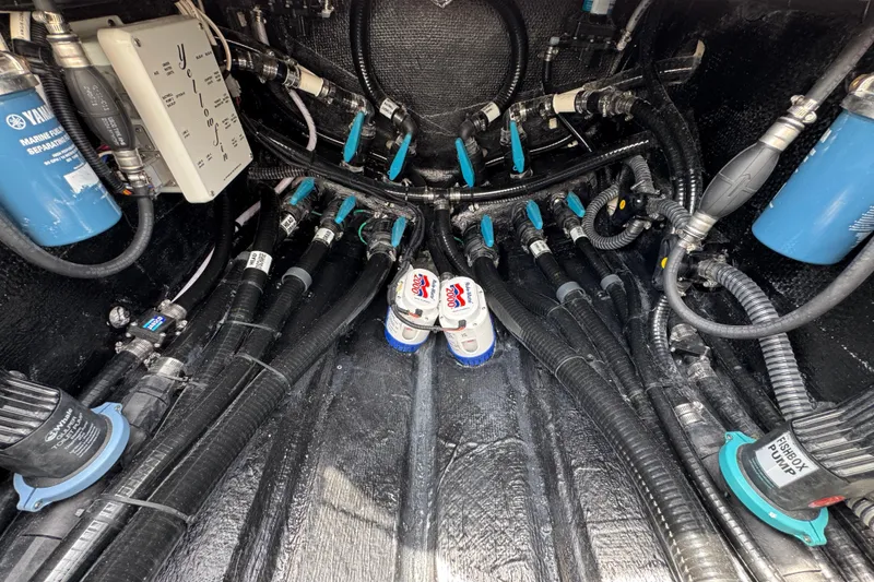 Slide: The Image of Engine compartment of 2026 Yellowfin 36 Offshore boat with complex wiring and components. - 43