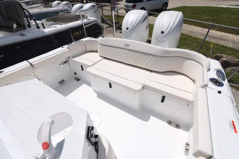 Slide: The Image of 2026 Sea Hunt Ultra 265 SE boat interior with sink and storage area. - 15