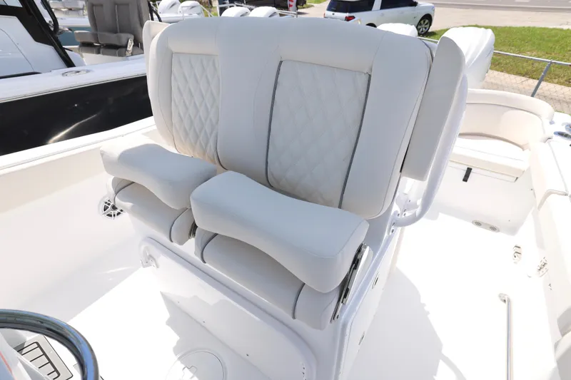 Slide: The Image of 2026 Sea Hunt Ultra 265 SE boat interior with Yamaha cooler and seating area. - 16