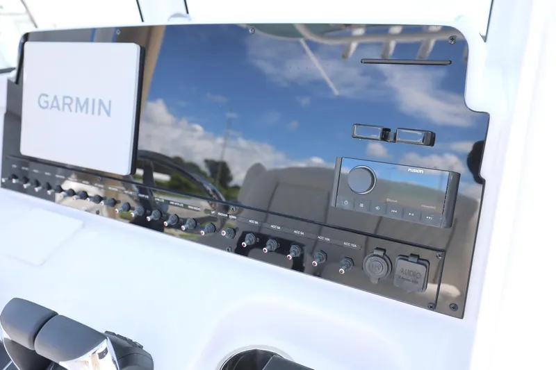 Slide: The Image of 2026 Sea Hunt Ultra 265 SE boat with luxurious white seating and armrests. - 18