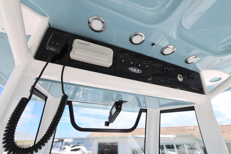 Slide: The Image of 2026 Sea Hunt Ultra 265 SE boat dashboard with Garmin navigation system. - 22
