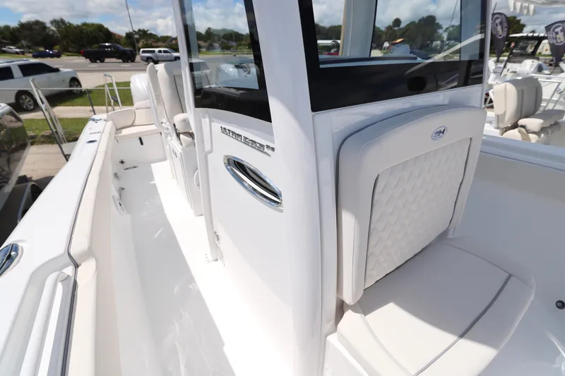 Slide: The Image of 2026 Sea Hunt Ultra 265 SE boat interior with Garmin equipment and sleek design. - 24