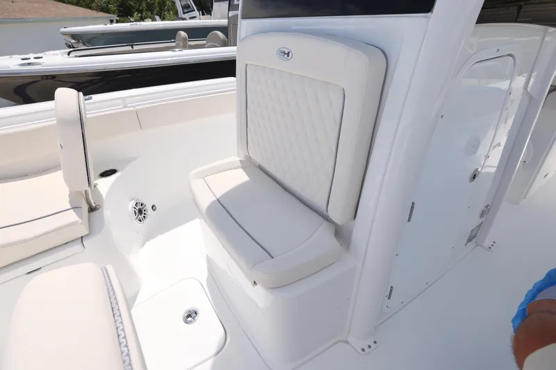 Slide: The Image of 2026 Sea Hunt Ultra 265 SE boat interior, showcasing seating and sleek design. - 26