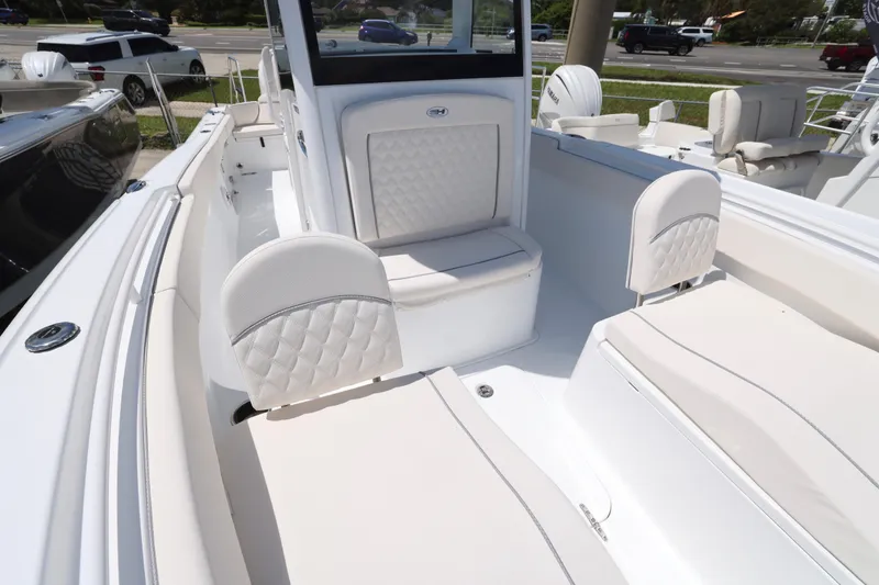 Slide: The Image of 2026 Sea Hunt Ultra 265 SE boat interior with cushioned seating and sleek design. - 29