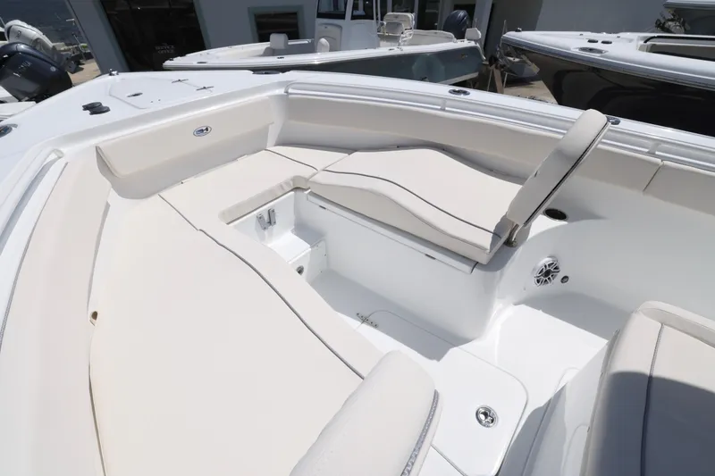 Slide: The Image of 2026 Sea Hunt Ultra 265 SE boat with open storage compartment on deck. - 30