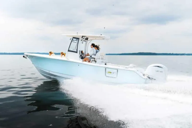 Slide: The Image of Family enjoying a day on a 2025 Sea Hunt Ultra 265 SE boat. - 41