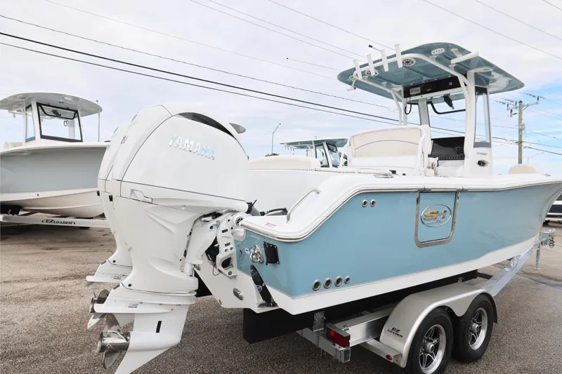 Slide: The Image of 2026 Sea Hunt Ultra 265 SE boat console with Garmin navigation system and steering wheel. - 6