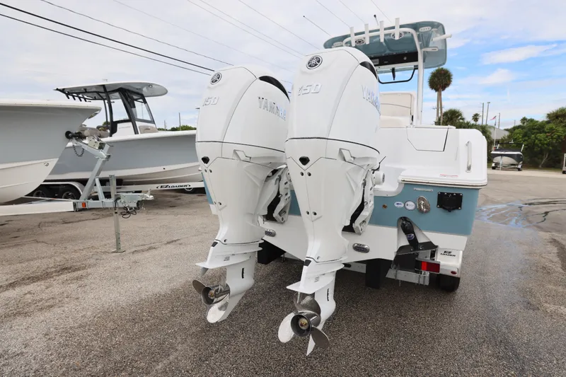 Slide: The Image of 2026 Sea Hunt Ultra 265 SE boat interior with white seating and cup holders. - 7
