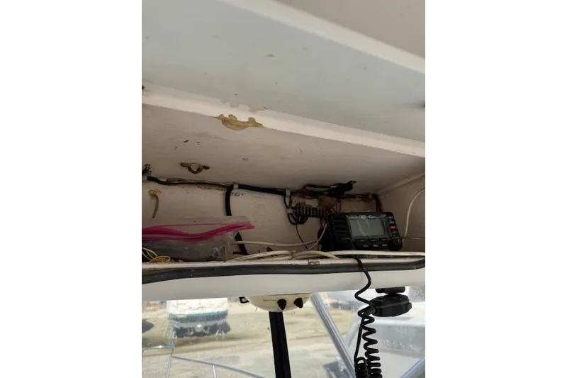 Slide: The Image of Interior view of a 1999 Pro-Line 24 Walkaround boat with radio equipment. - 10