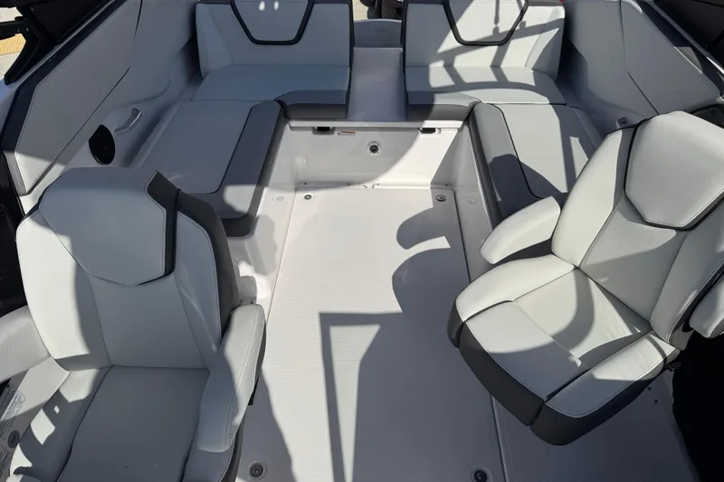 Slide: The Image of 2025 Yamaha Boats AR250 interior with modern seating and sleek design. - 13
