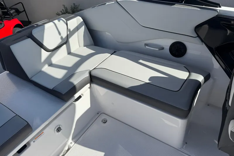 Slide: The Image of 2025 Yamaha Boats AR250 interior seating with modern design and comfortable upholstery. - 16