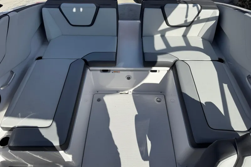 Slide: The Image of 2025 Yamaha Boats AR250 interior seating with modern design and comfortable upholstery. - 17