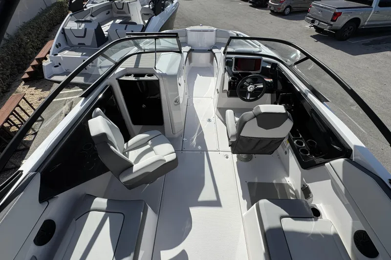 Slide: The Image of 2025 Yamaha Boats AR250 interior with modern seating and sleek dashboard design. - 5