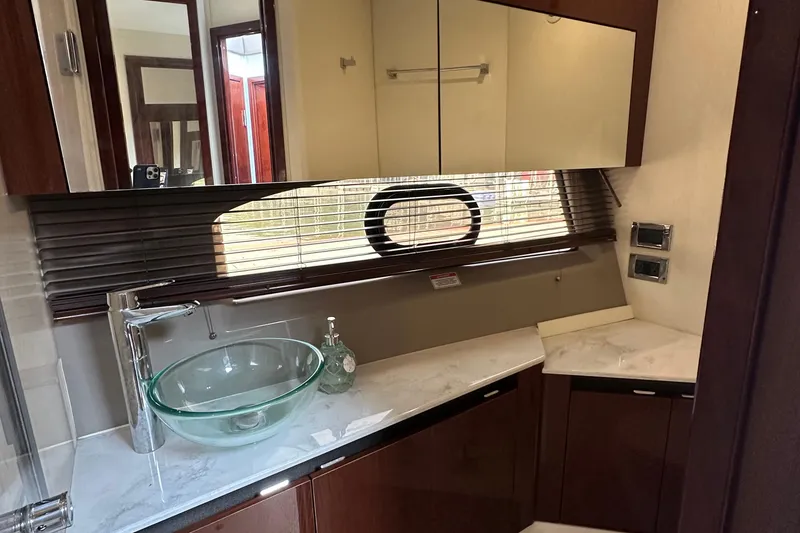 Slide: The Image of Luxurious bathroom interior of 2017 Sea Ray Fly 460 yacht with glass sink and modern fixtures. - 10
