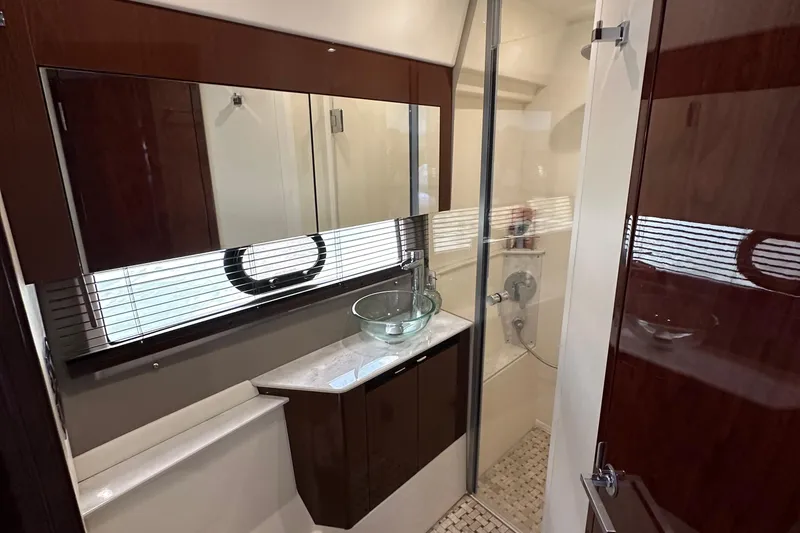 Slide: The Image of Luxurious bathroom in 2017 Sea Ray Fly 460 yacht with glass sink and shower. - 11