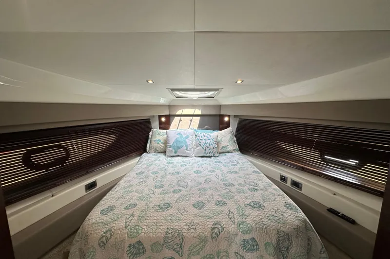 Slide: The Image of Luxurious cabin interior of 2017 Sea Ray Fly 460 yacht with elegant bedding and ambient lighting. - 8