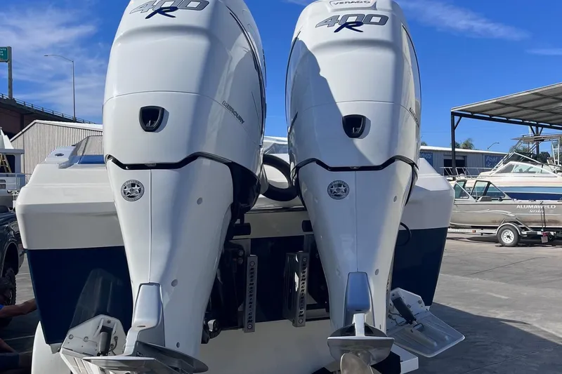 Slide: The Image of 2017 Formula 292 SR-1 boat with twin Mercury 400R outboard engines at a marina. - 14