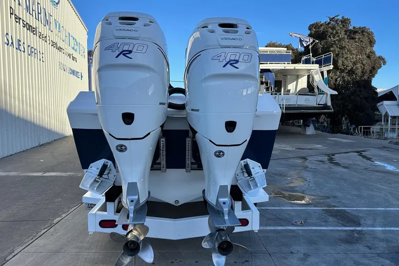 Slide: The Image of 2017 Formula 292 SR-1 boat with twin Mercury Verado 400R engines at a marina. - 15