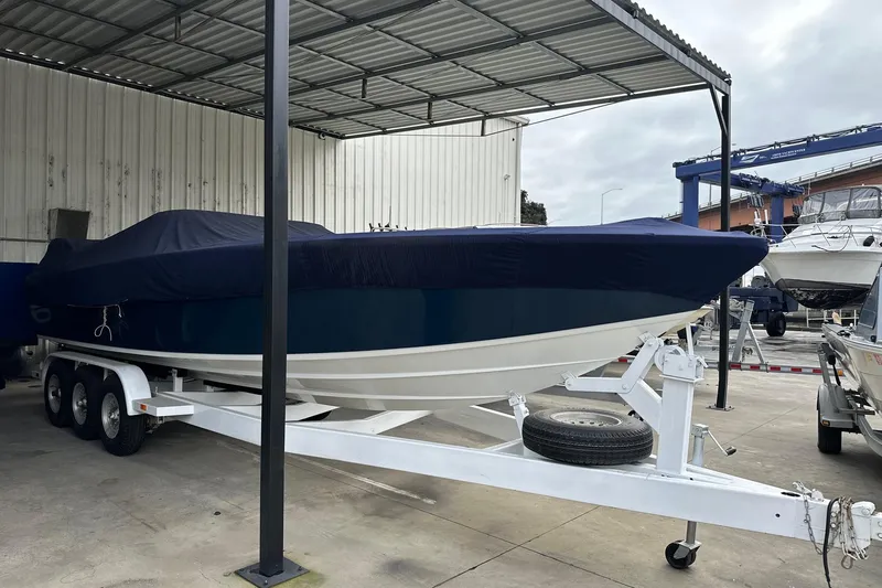 Slide: The Image of 2017 Formula 292 SR-1 boat covered on a trailer in a sheltered area. - 18