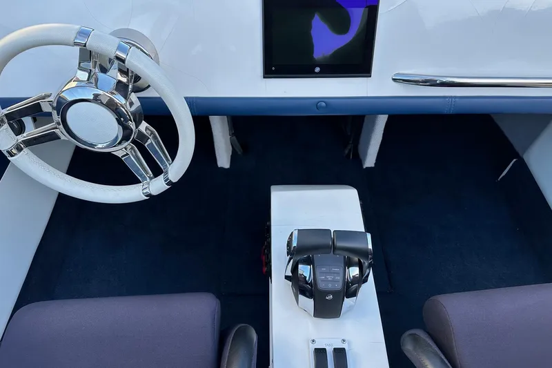 Slide: The Image of 2017 Formula 292 SR-1 cockpit with modern steering wheel and control panel. - 24