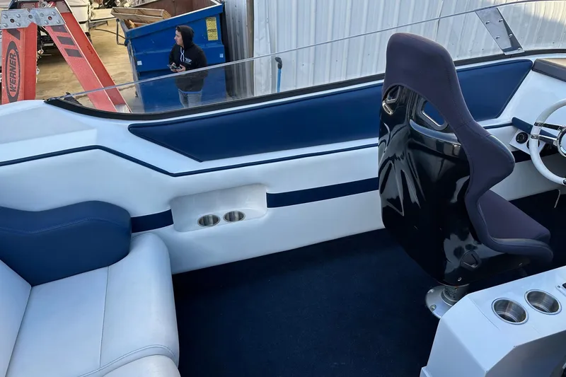Slide: The Image of 2017 Formula 292 SR-1 boat interior with blue and white seating and steering wheel. - 27