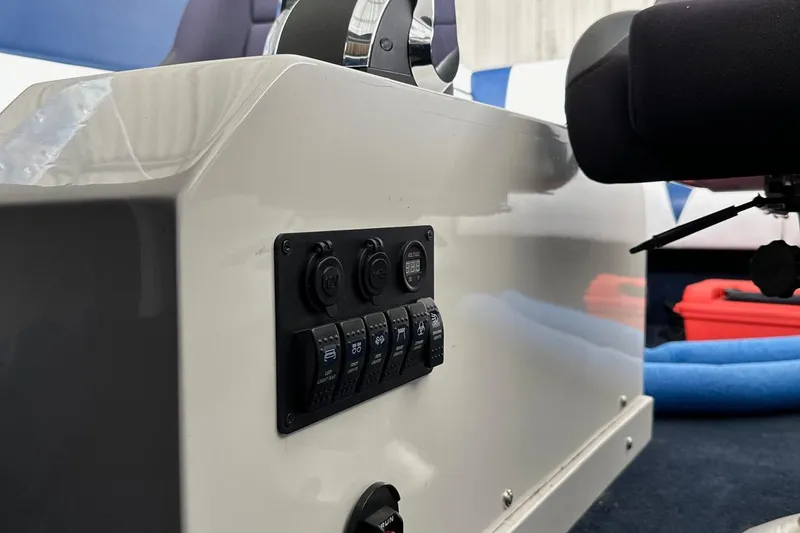 Slide: The Image of Control panel of a 2017 Formula 292 SR-1 boat with switches and outlets. - 34