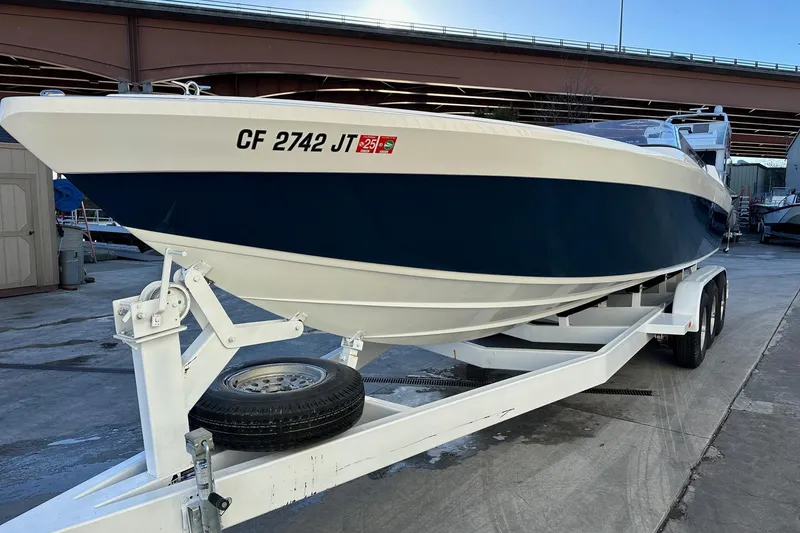 Slide: The Image of 2017 Formula 292 SR-1 boat on trailer, parked under a bridge. - 9