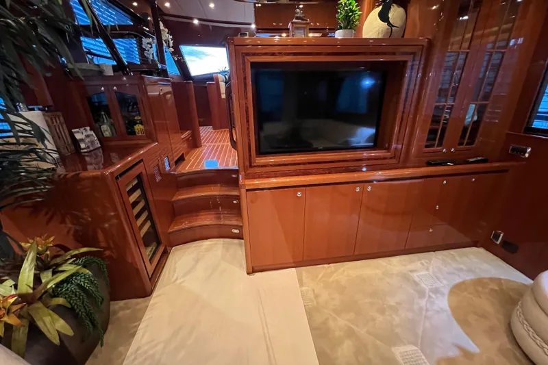 Slide: The Image of Luxurious 2012 Hampton motor yacht interior with elegant wood finishes and modern entertainment system. - 18